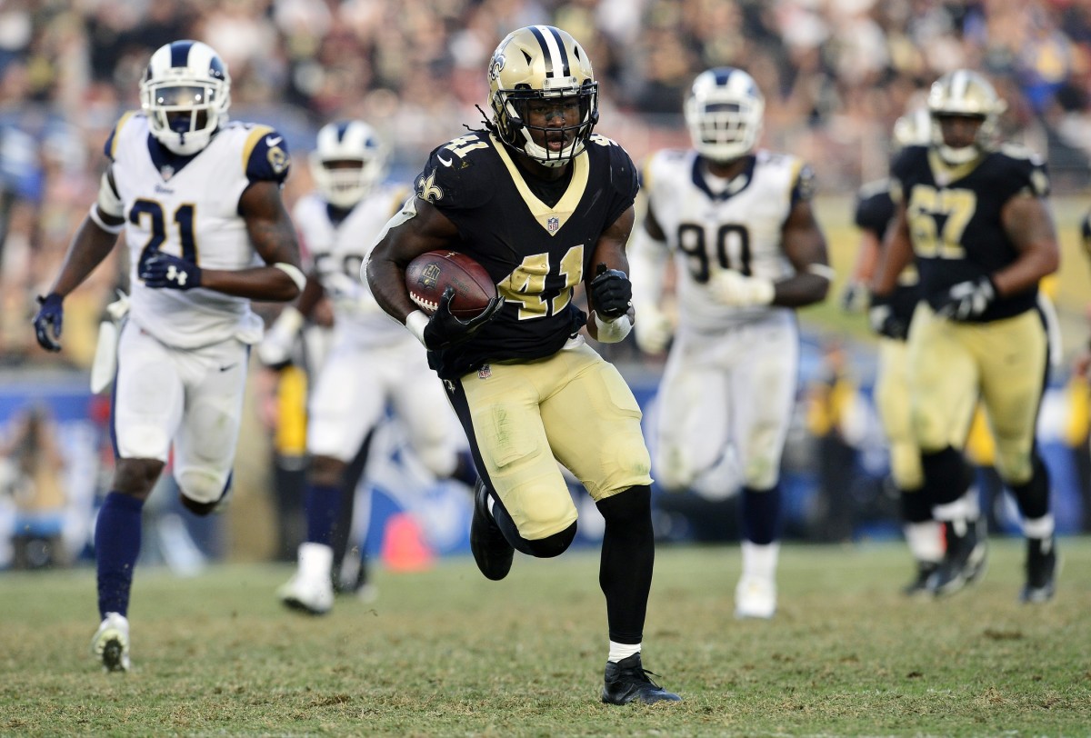 New Orleans Saints running back Alvin Kamara (41) runs against the Los Angeles Rams defense. Mandatory Credit: Gary A. Vasquez-USA TODAY 